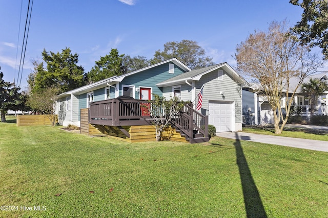 view of front of house with a garage, a deck, and a front lawn