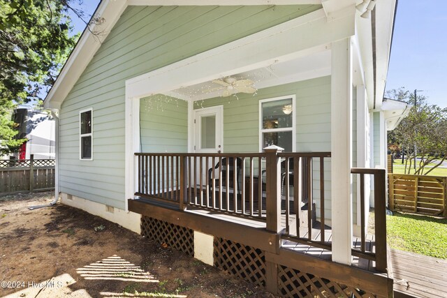 view of exterior entry with a deck