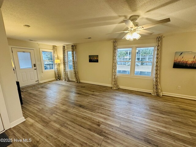 kitchen featuring white cabinets, decorative light fixtures, stainless steel appliances, decorative backsplash, and a chandelier