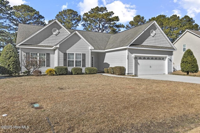 front facade featuring a front lawn and a garage