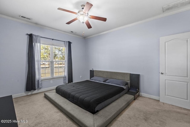 bedroom featuring light carpet, ceiling fan, and crown molding