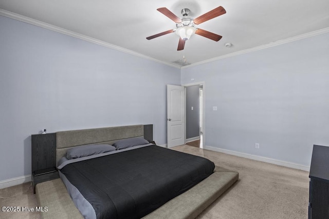 carpeted bedroom with ceiling fan and crown molding