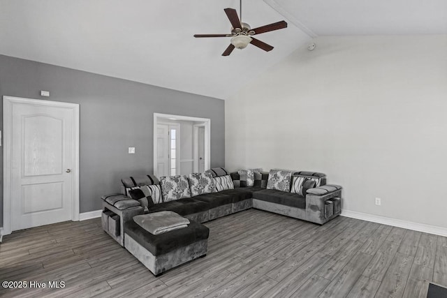 living room with ceiling fan, lofted ceiling with beams, and light hardwood / wood-style floors