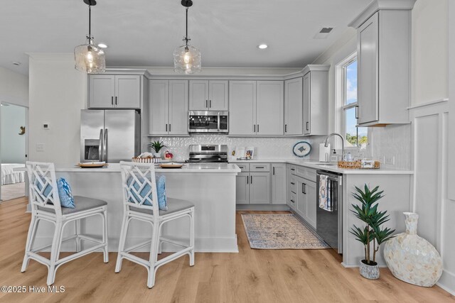 living room featuring crown molding, ceiling fan, and light wood-type flooring