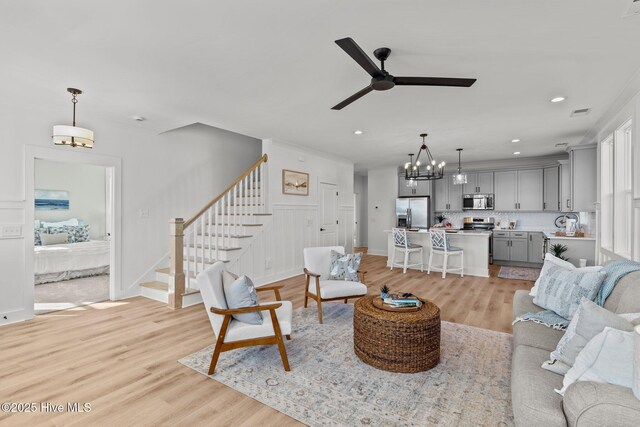 kitchen with sink, gray cabinets, stainless steel appliances, and a healthy amount of sunlight