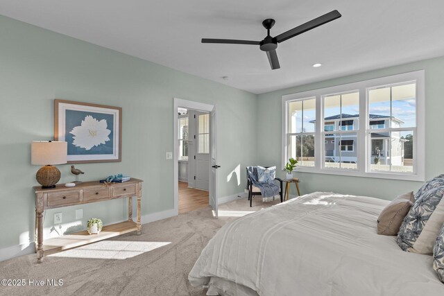 bedroom with light carpet and ceiling fan