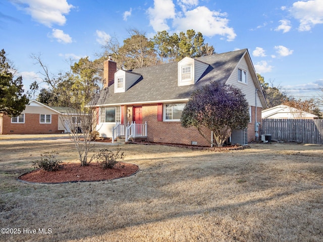 new england style home with a front lawn and central air condition unit