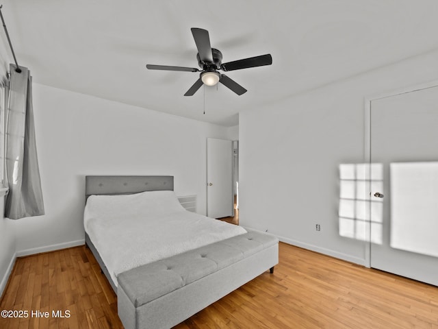 bedroom featuring hardwood / wood-style flooring and ceiling fan