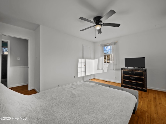 bedroom featuring hardwood / wood-style flooring and ceiling fan