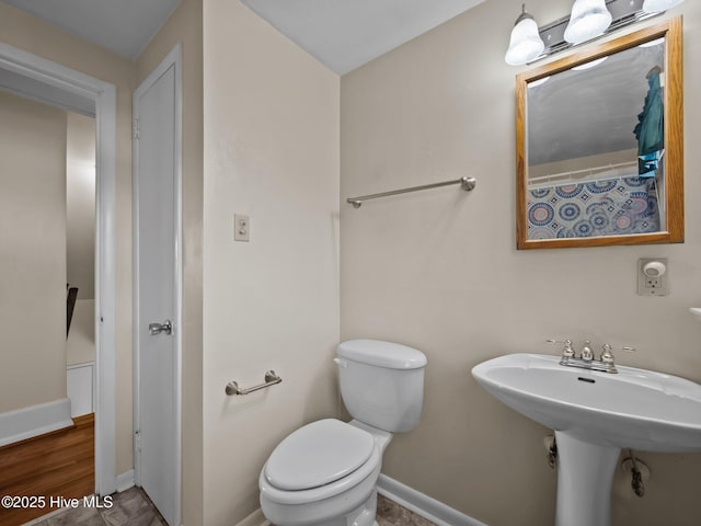 bathroom featuring sink and toilet