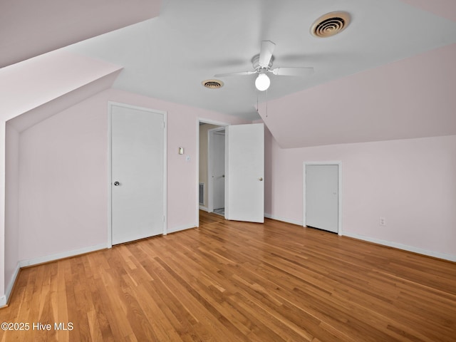 bonus room with ceiling fan, lofted ceiling, and light hardwood / wood-style floors