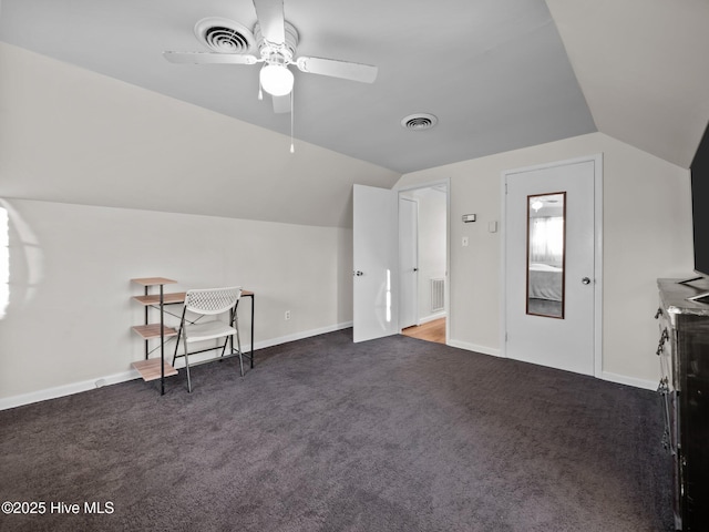 bonus room featuring vaulted ceiling, ceiling fan, and dark carpet