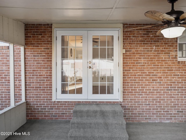 property entrance with french doors and ceiling fan