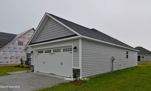 view of side of property with a lawn