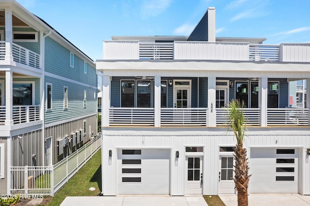 view of front facade with a balcony and a garage