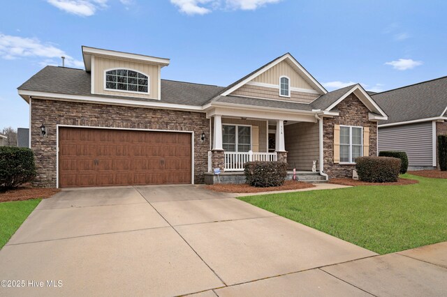 view of front facade with covered porch and a garage