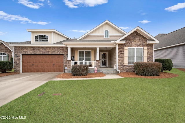 craftsman inspired home featuring a garage, a front yard, and covered porch