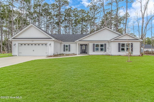 single story home featuring a garage and a front lawn