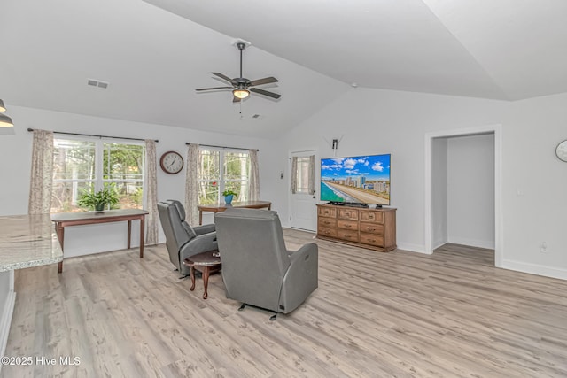 dining space featuring lofted ceiling, light hardwood / wood-style flooring, and ceiling fan