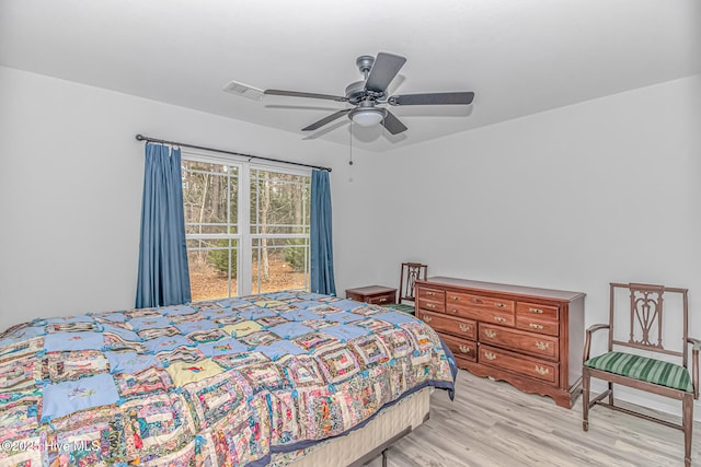 bedroom with ceiling fan and light hardwood / wood-style flooring