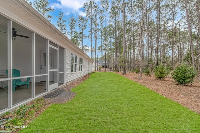 view of yard with a sunroom