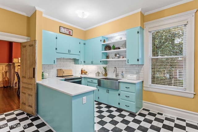kitchen featuring a sink, light floors, open shelves, and blue cabinetry