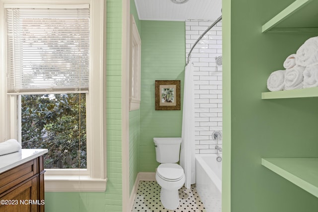 bathroom with vanity, toilet, and bathing tub / shower combination
