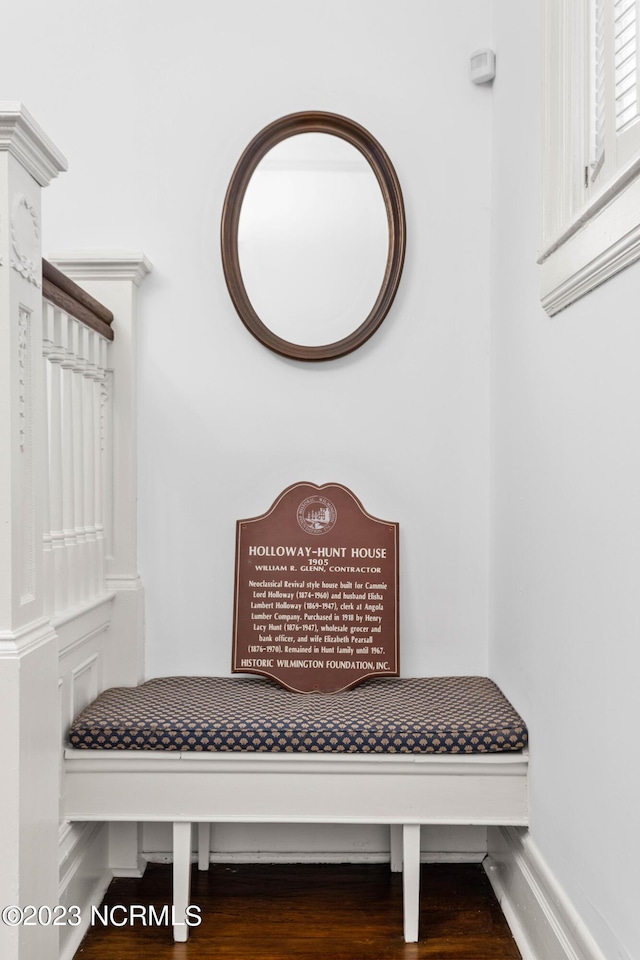mudroom featuring baseboards and wood finished floors