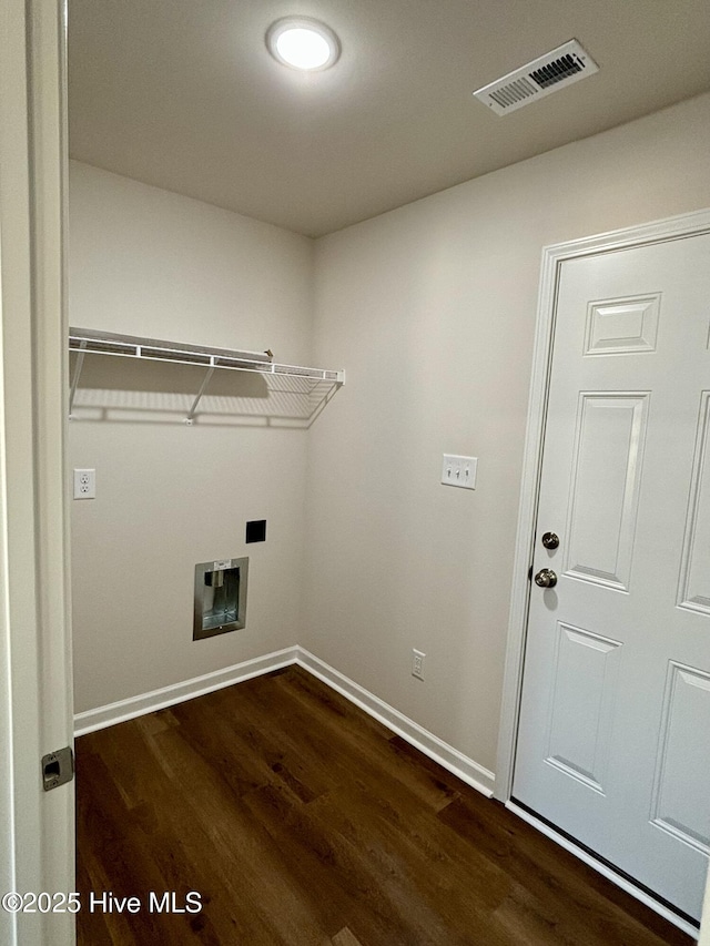 washroom with dark wood-type flooring and hookup for a washing machine