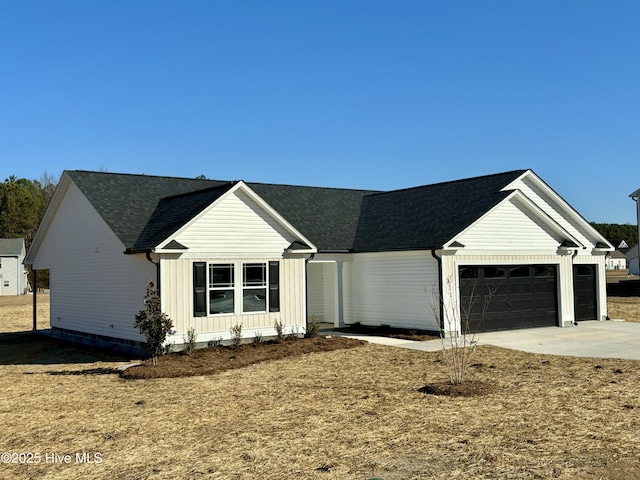 modern inspired farmhouse with a garage