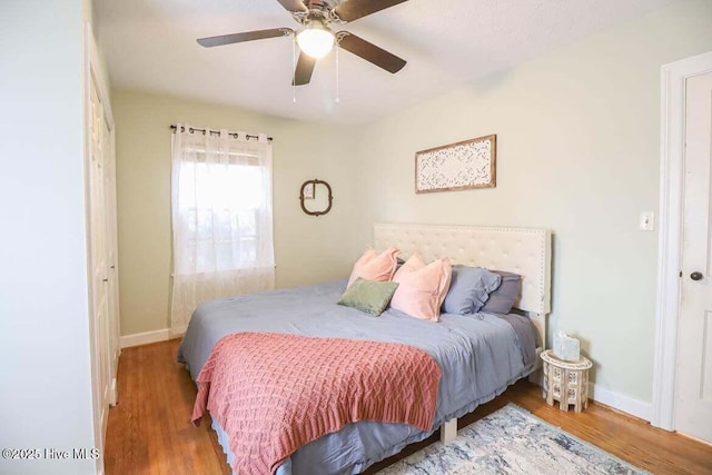 bedroom featuring ceiling fan and wood-type flooring