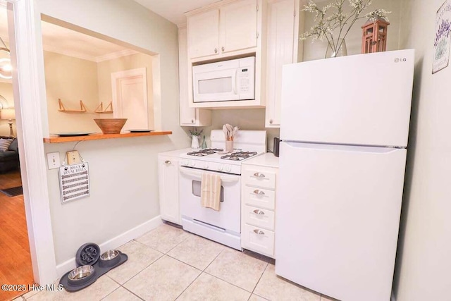 kitchen with white cabinetry, white appliances, ornamental molding, and light tile patterned flooring