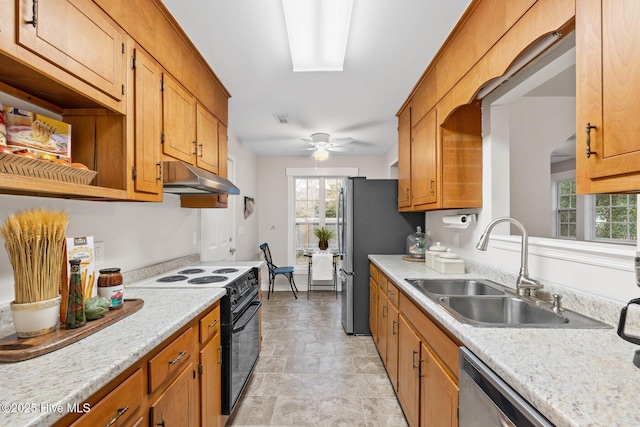 kitchen featuring ceiling fan, stainless steel appliances, plenty of natural light, and sink