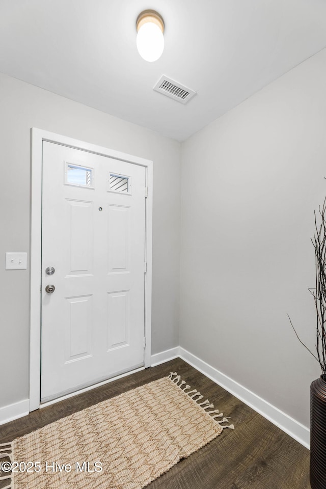 foyer entrance with dark hardwood / wood-style flooring