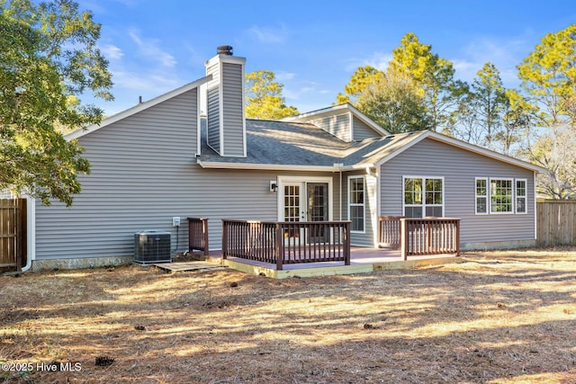 back of property with central AC and a wooden deck