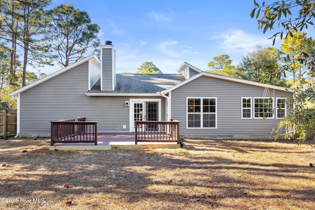 rear view of property featuring a deck