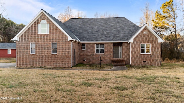 back of house with a lawn