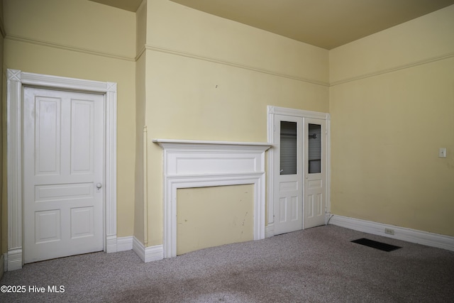 unfurnished living room with carpet