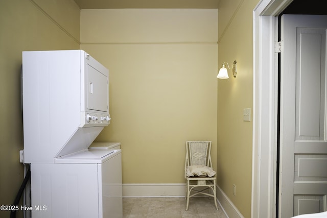 laundry area with stacked washing maching and dryer