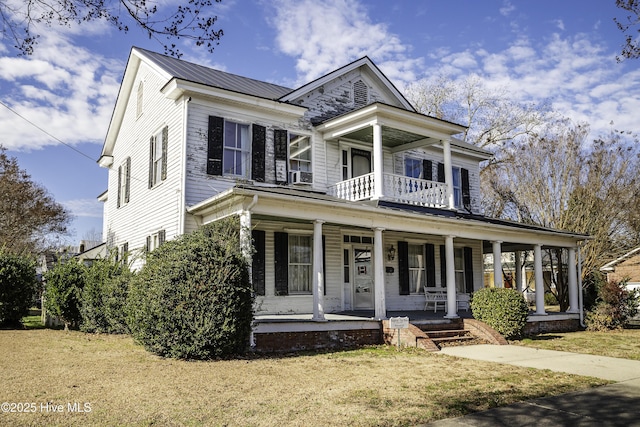 view of front of property with a front lawn and a porch