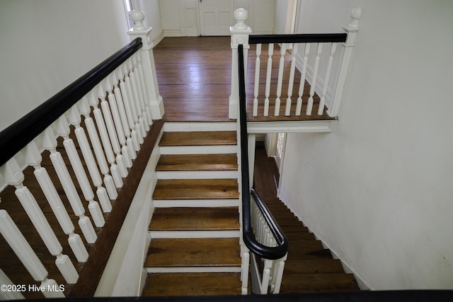 stairway featuring hardwood / wood-style flooring