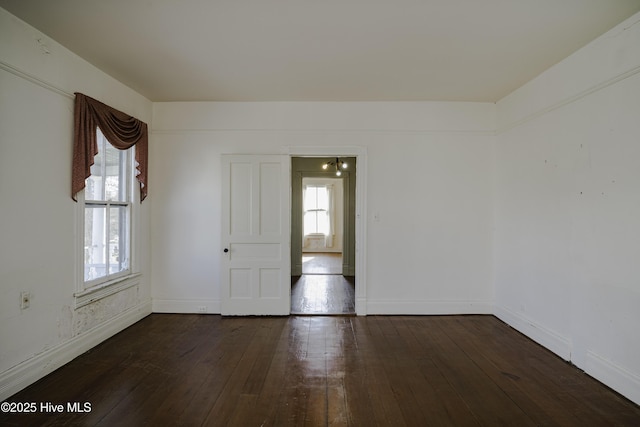 empty room featuring dark hardwood / wood-style floors