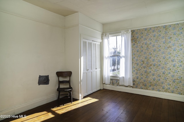 spare room with dark wood-type flooring