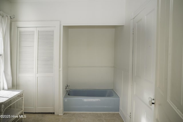 bathroom featuring vanity and a bath