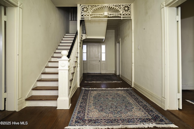 stairs with hardwood / wood-style floors