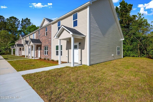 211 Lincoln Place Cir, Leland, NC 28451 - view of front facade featuring a front yard