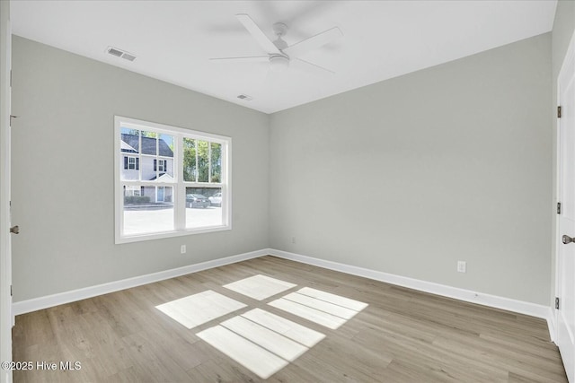 211 Lincoln Place Cir, Leland, NC 28451 - unfurnished room featuring light wood-type flooring, a ceiling fan, and baseboards
