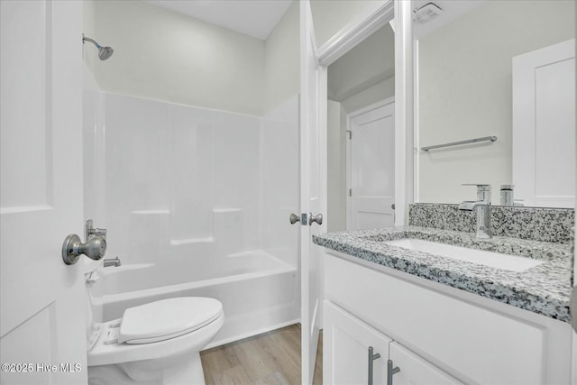 211 Lincoln Place Cir, Leland, NC 28451 - bathroom with vanity, toilet, shower / tub combination, and wood finished floors