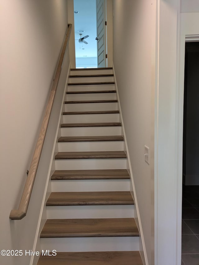 stairs with ceiling fan