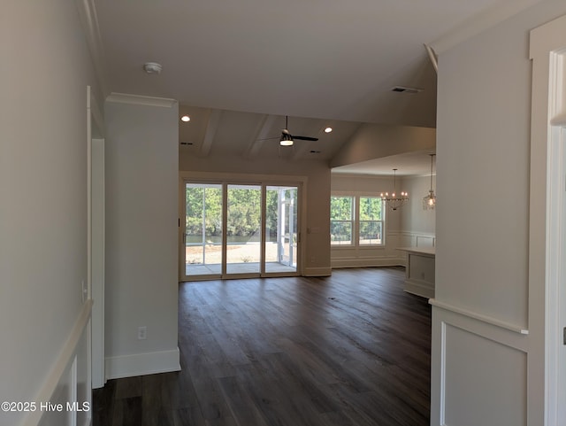 unfurnished room with recessed lighting, a wainscoted wall, dark wood-style flooring, a decorative wall, and ceiling fan with notable chandelier